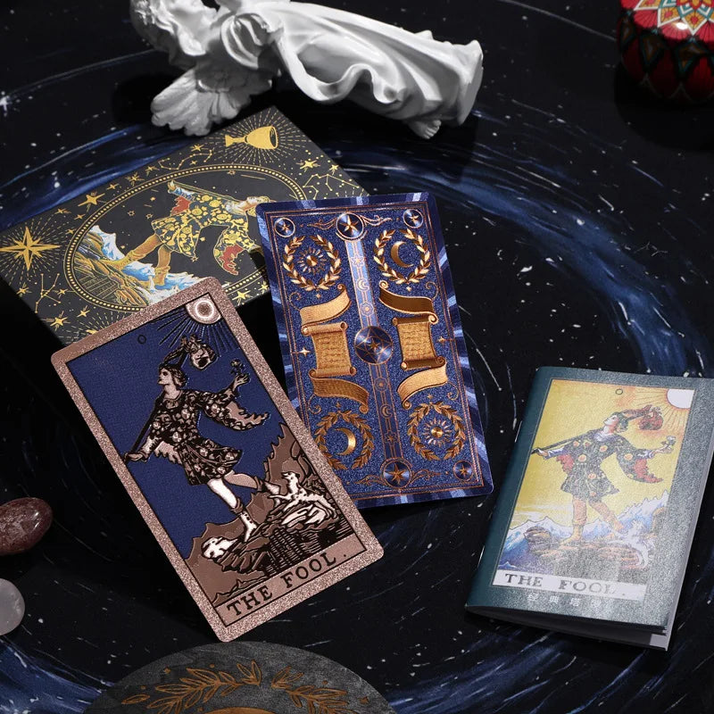 Blue and gold Rider-Waite-Smith tarot cards with The Fool card and decorative celestial box