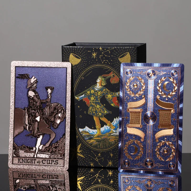 Knight of Cups tarot card and ornate blue gold card back beside decorative tarot gift box