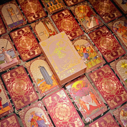 Crimson floral gold foil tarot deck with pink presentation box and card spread